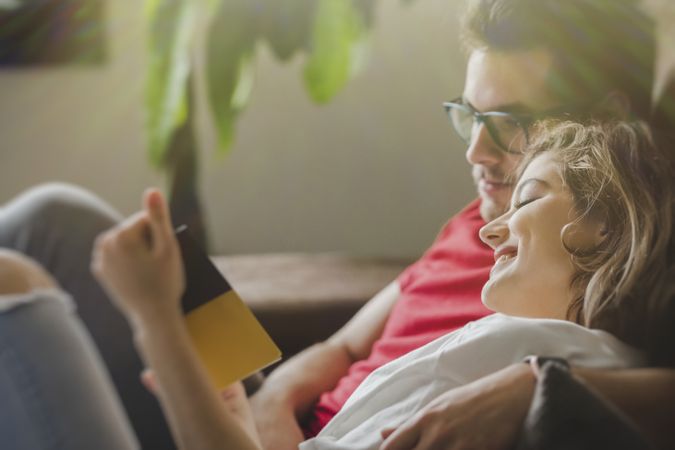 Dreamy couple with brochure