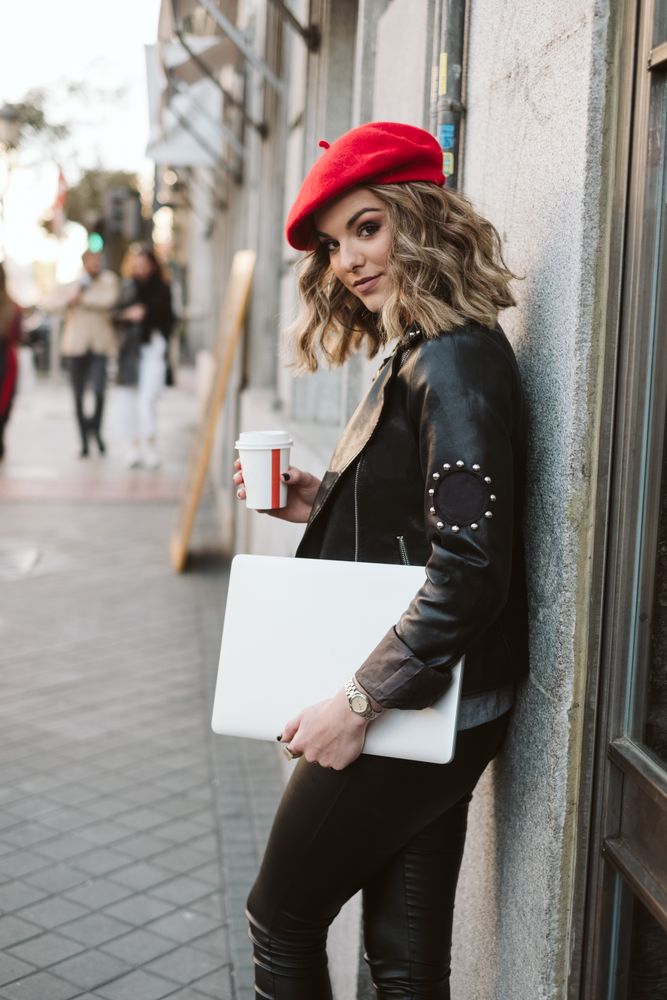 Woman with drink on the street