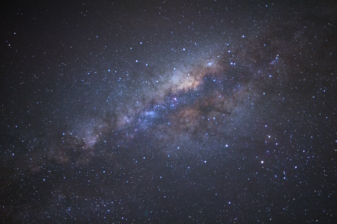 Milky way galaxy with stars and space dust in the universe, Long exposure photograph, with grain.
