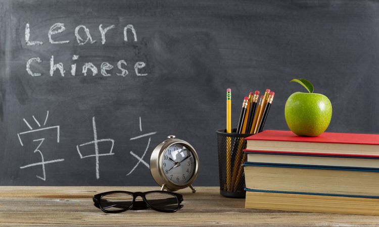 Student desk prepared to learn Chinese language