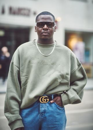 London, England, United Kingdom - September 18 2021: Man in sweater and jeans with belt