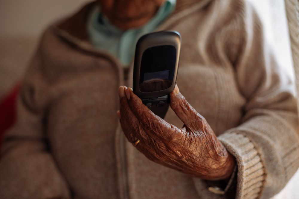 Older person using his phone