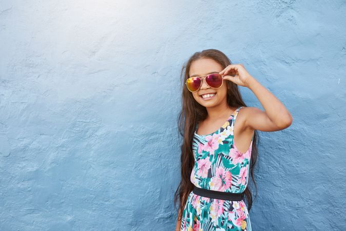 Portrait of stylish little girl with sunglasses
