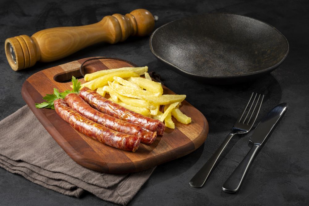 Grilled German sausage with french fries.