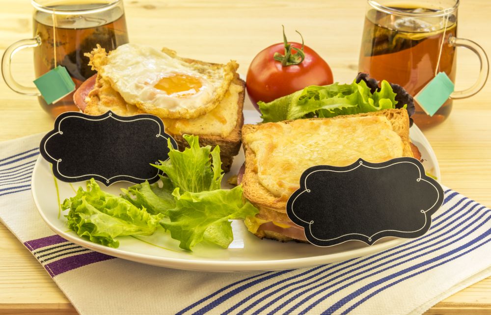 Sandwiches and tea cups for a pair