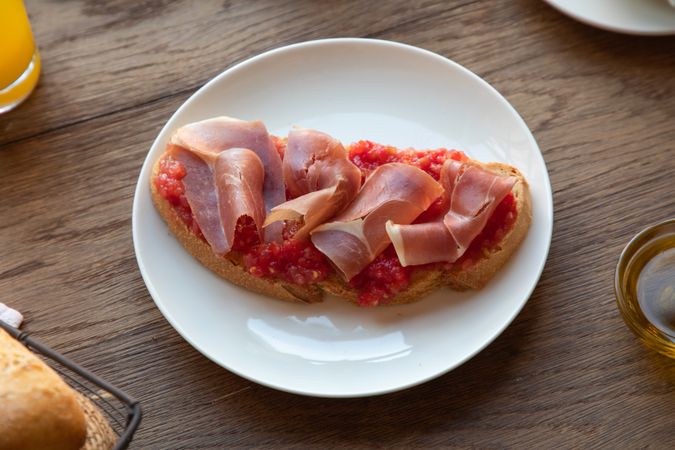 Stylish serving dishes with sandwich for breakfast
