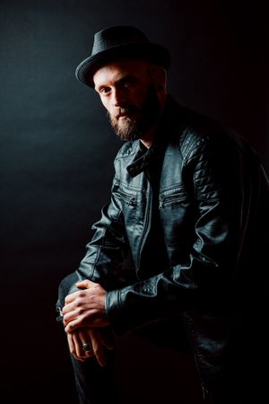 Young bearded guy in leather jacket