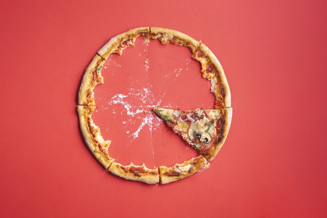 Single slice of pizza and left over crust ring