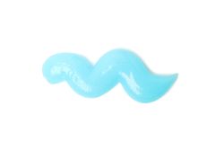 Blue squeezed toothpaste isolated on light background