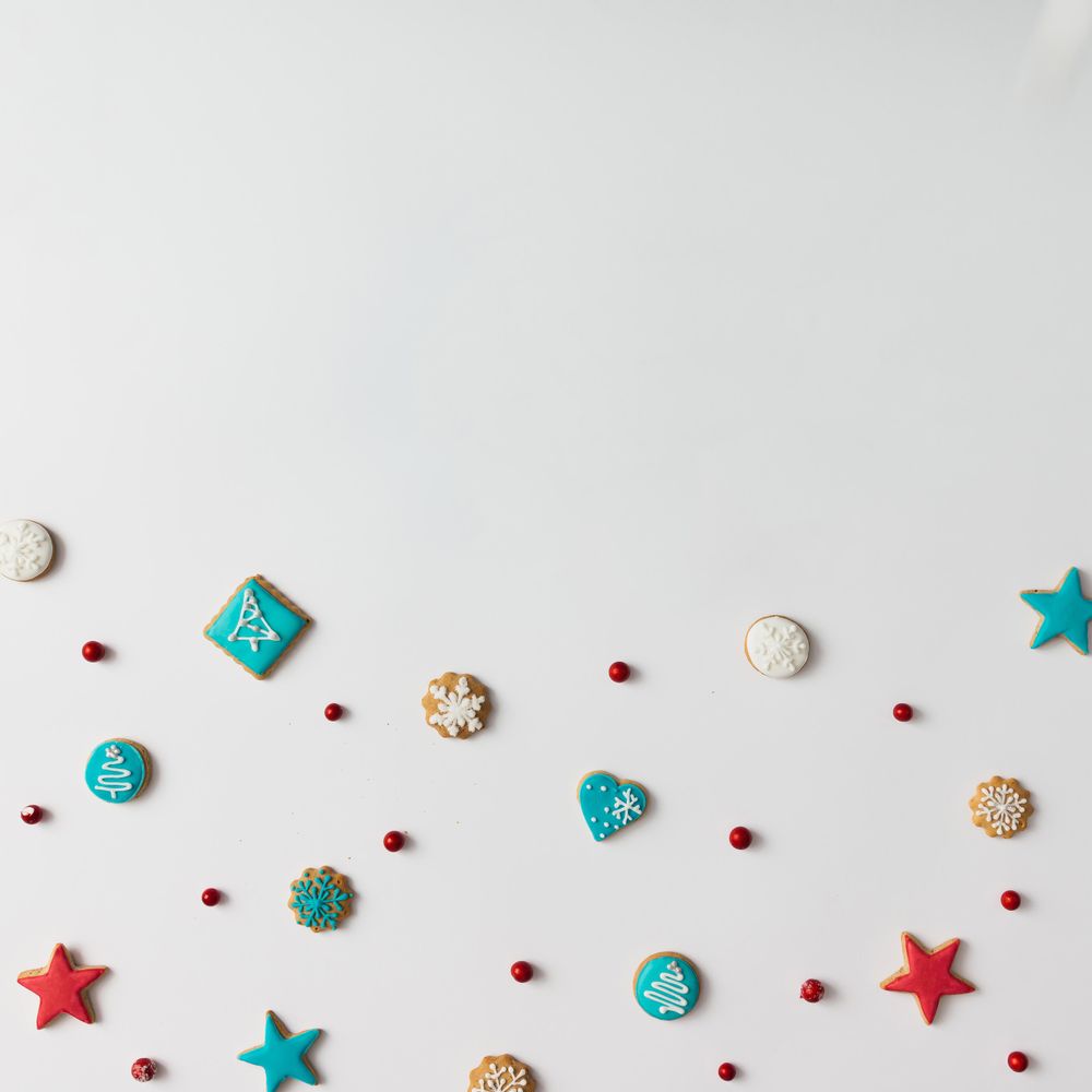 Colorful pattern made of Christmas cookies and red berries