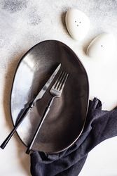 Elegant modern table setting with salt and pepper shakers