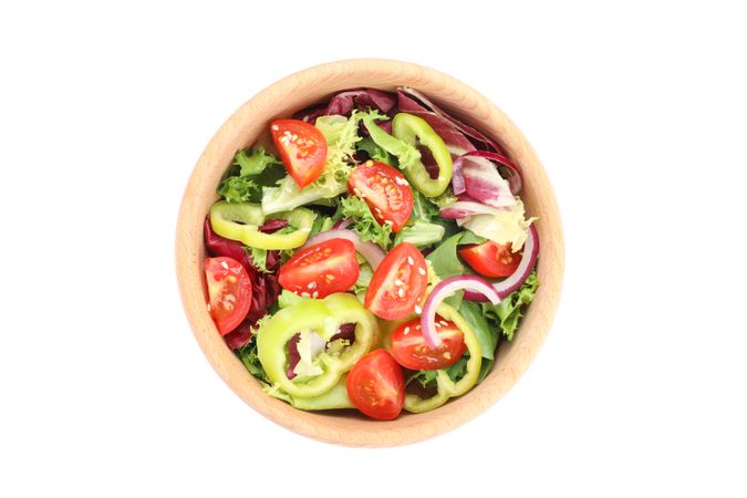 Wooden bowl with fresh salad isolated on plain background