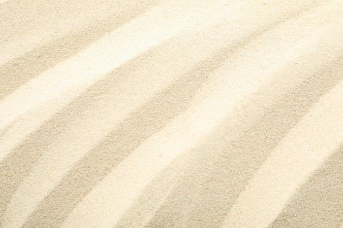 Clear sea sand as background, space for text and closeup. Summer vacation background
