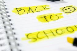 Notebook with writing Back to School with green stabilo