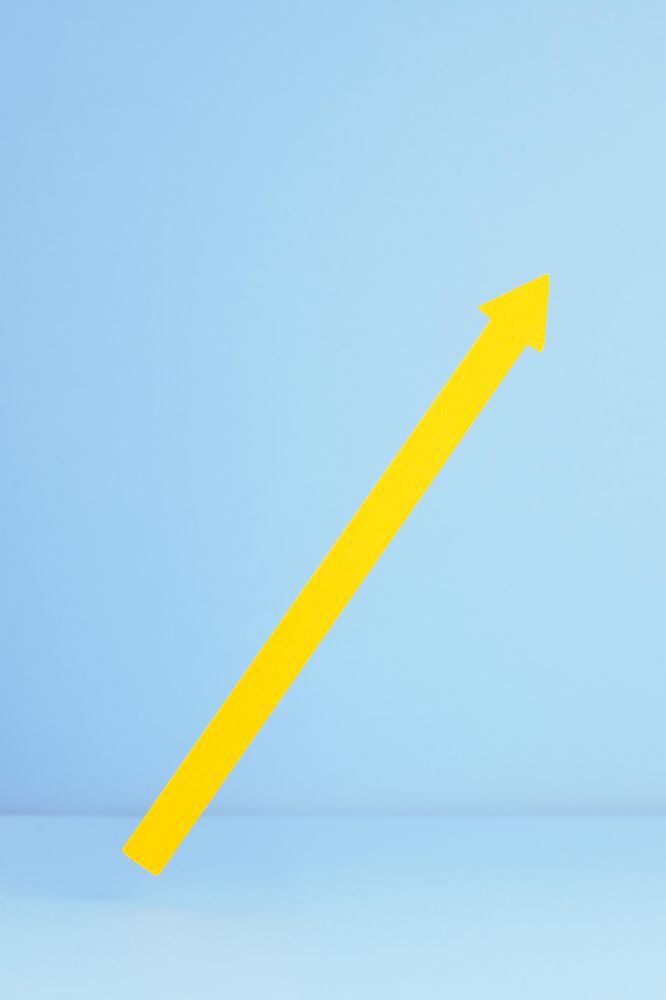 Yellow arrow pointing up over blue background