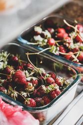 Strawberries in glass containers, selective focus