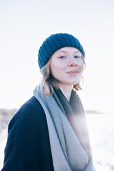 Red haired woman in hat and scarf