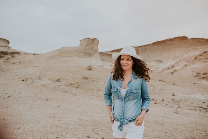 Female tourist walking on sandy quarry