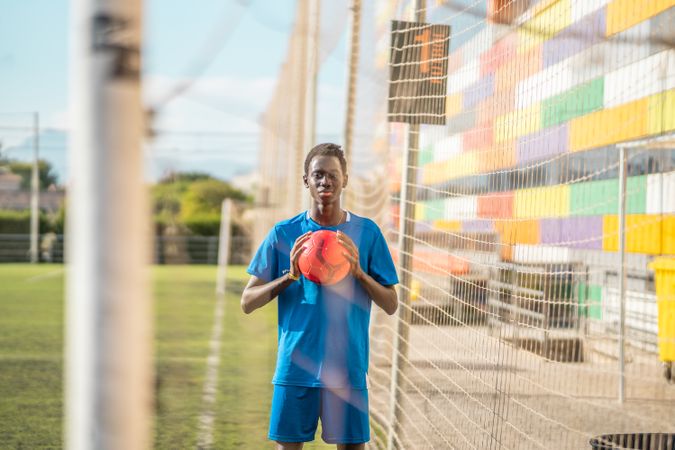 Black teenager on football field