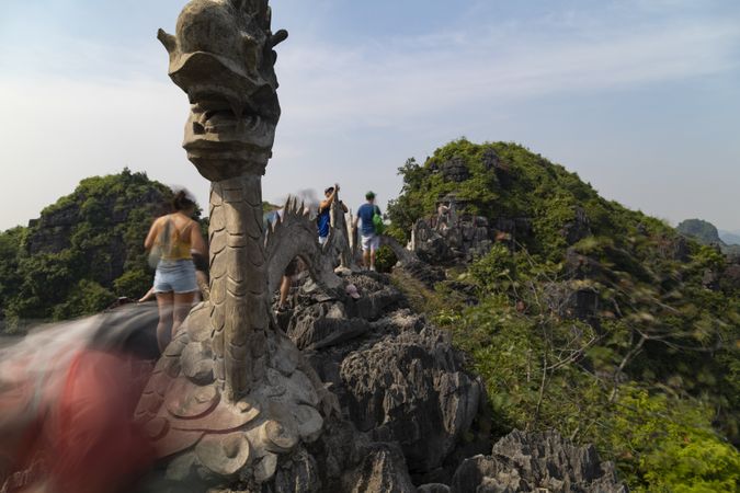 Hang Mua, Vietnam - Nov 11, 2019: A stone dragon statue atop Hang Mua, famous mountain and shrine