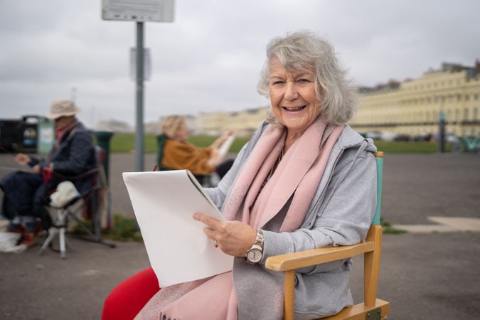 Portrait of smiling woman drawing