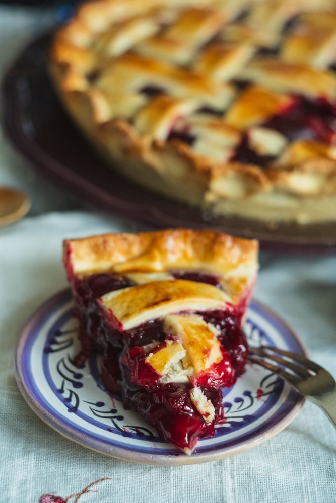 Close-up of delicious cherry pie slice with lattice topping