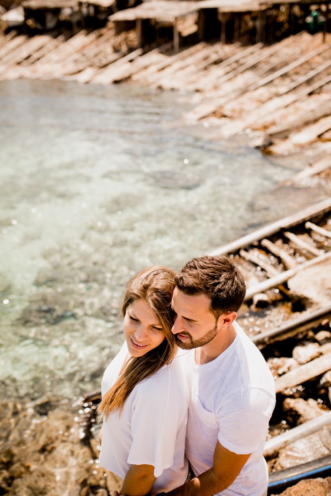 Happy lovers cuddling at cove