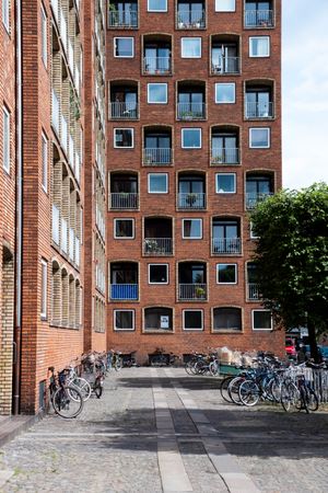 Apartment windows and patios in red brick building in Copenhagen