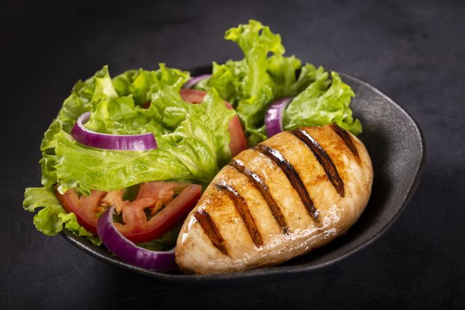 Tasty grilled chicken with salad.