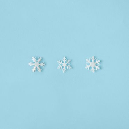 Row of snowflakes on blue background
