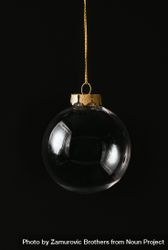 Christmas dark background with clear bauble decoration 0JW2N5