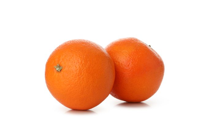 Ripe sweet mandarins isolated on light background