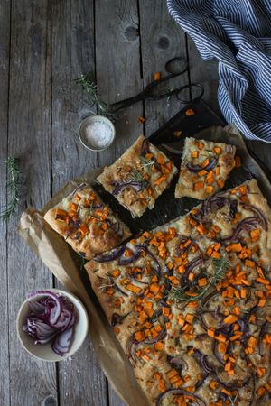 top view of Pieces of fresh focaccia on wooden table