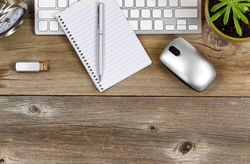 Rustic working desktop with accessories on upper part