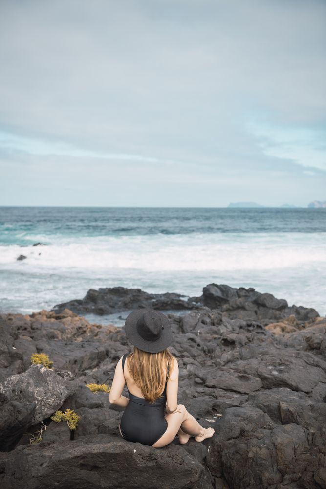 Sensual female near stormy sea