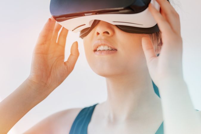 Close up shot of woman using the virtual reality headset and looking away
