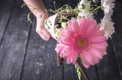 Bouquet of flowers held in unrecognizable hand