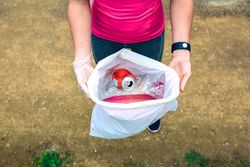 Woman showing garbage