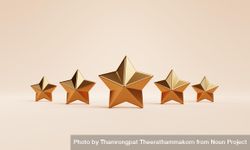 Gold star ornaments on beige background 5naYl0
