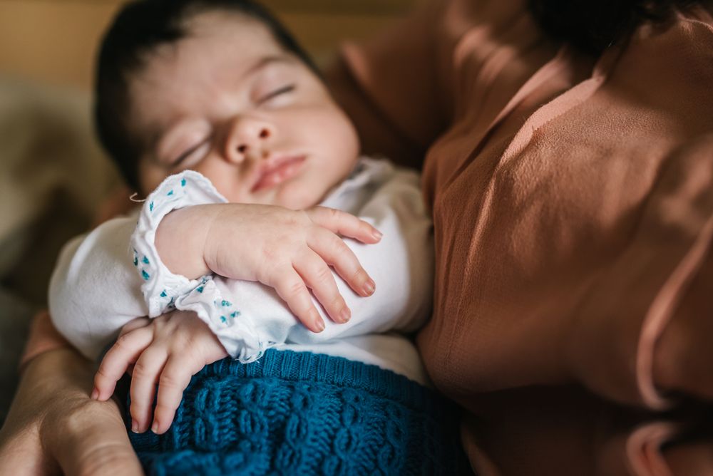 Mother holding baby in arms