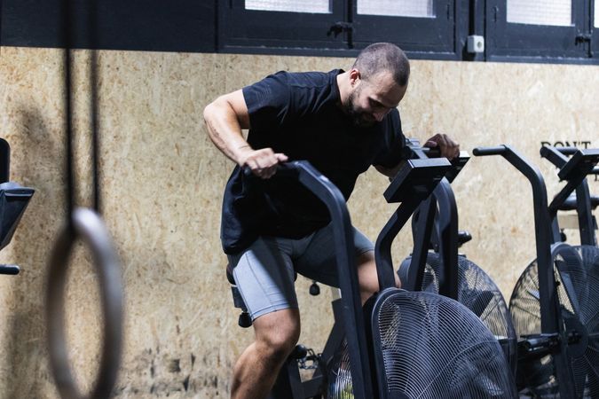 Man exercising on air bike