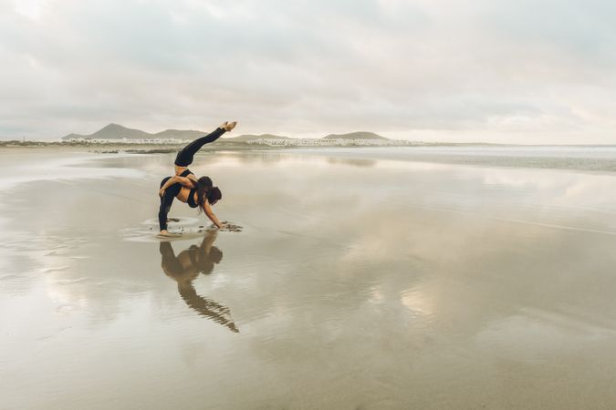Women exercising near sea