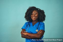 Portrait of confident and happy Black medical professional dressed in scrubs 5kaVDb