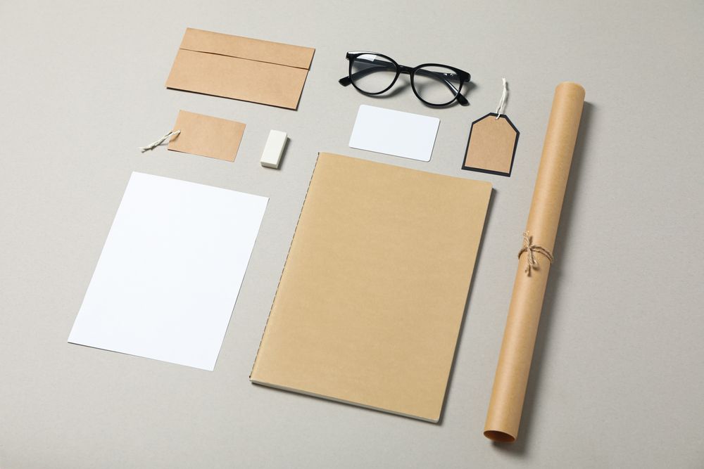 Mockup. Corporate stationery and glasses on grey background, copy space