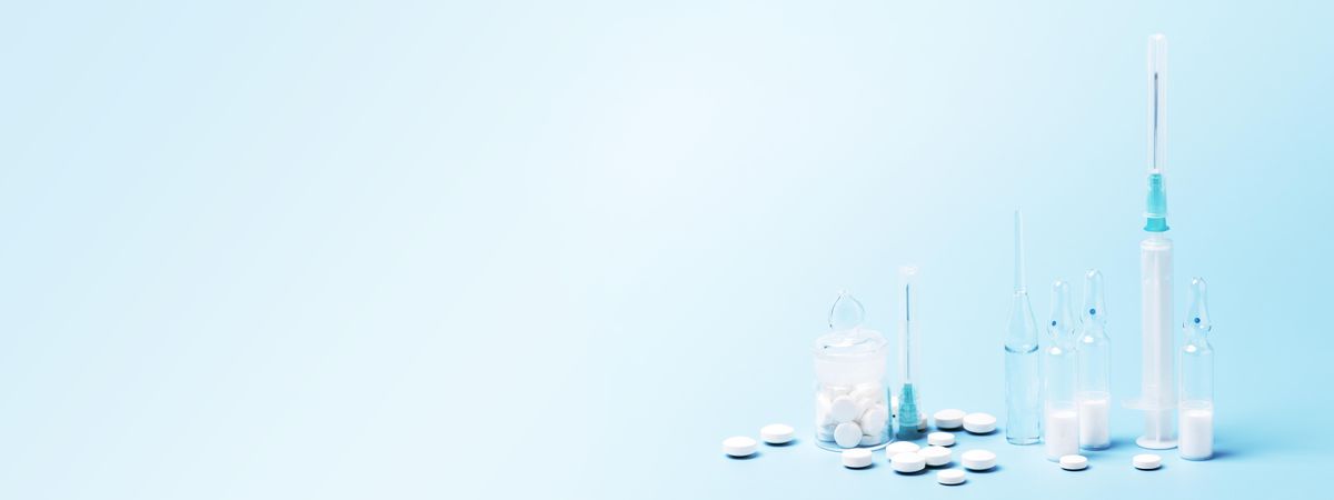 Banner of pills and medical needles on baby blue background