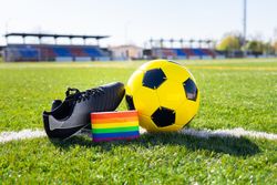 Captain armband with LGBT pride flag in the soccer field