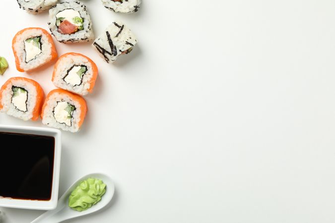 Delicious sushi rolls on light background, top view. Japanese food