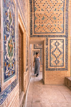 Unrecognizable tourist inside ancient building