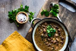 Top view of delicious hearty bean soup with parsley