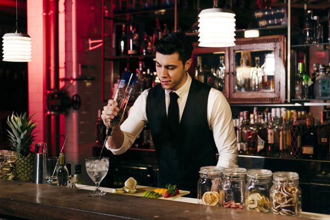 Barman working making drinks